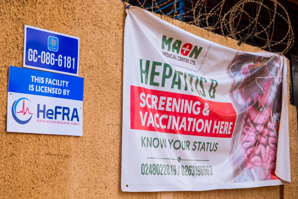 The Ghana Post GPS plate GC-086-6181 and the sign: this facility is licensed by HeFRA.