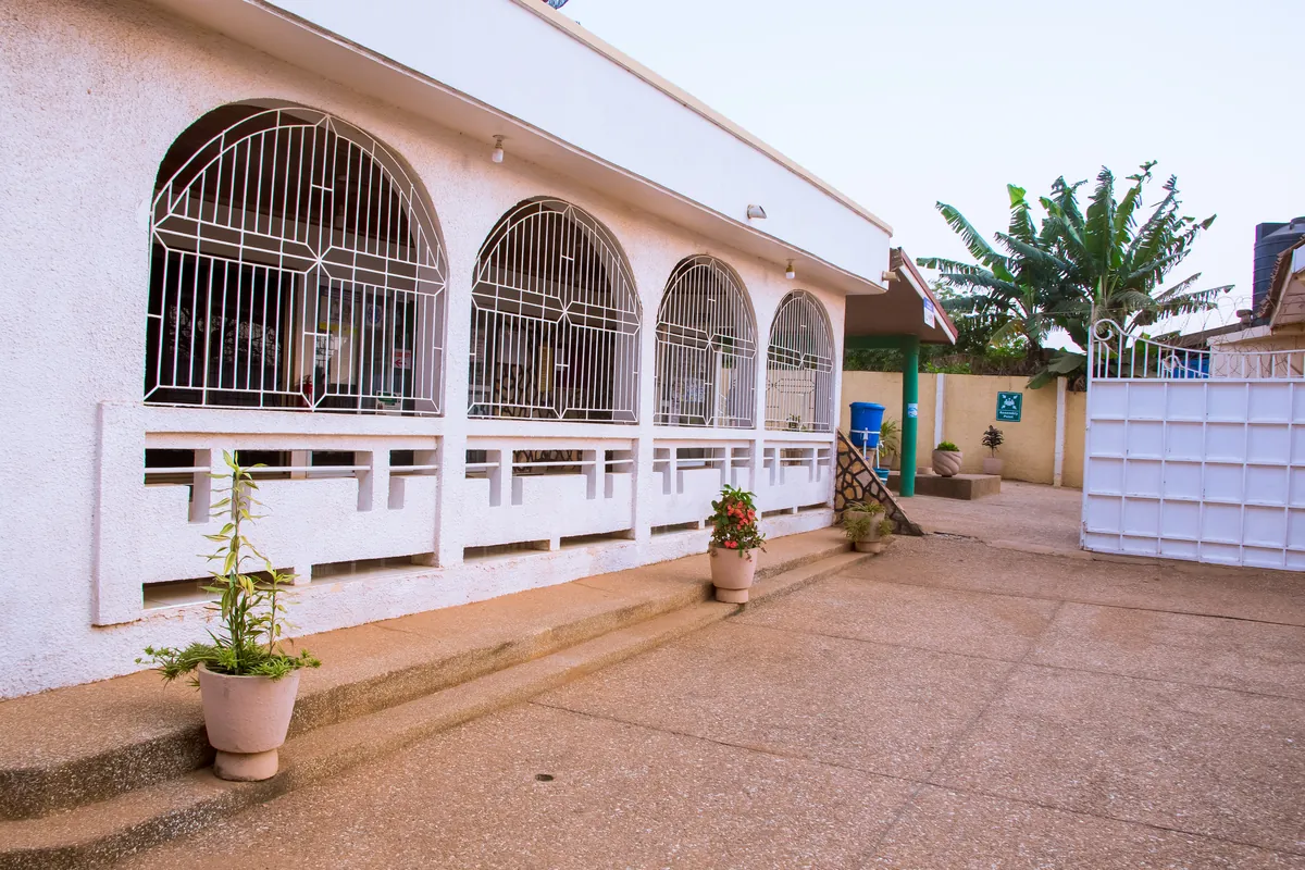 The arched veranda along the front of MAON Medical Centre.
